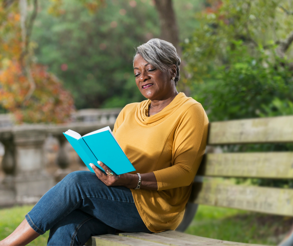 A woman sitting quieting in nature.