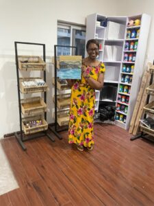 passion purpose ahelen holding a painting