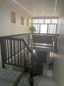 steps into the room
